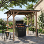 Cedar wood grill gazebo with metal roof, built-in serving shelves, and gas grill on a backyard patio