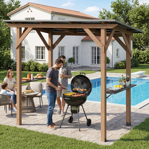 Cedar wood grill gazebo with metal roof and built-in serving shelves over a charcoal grill in a backyard poolside setting