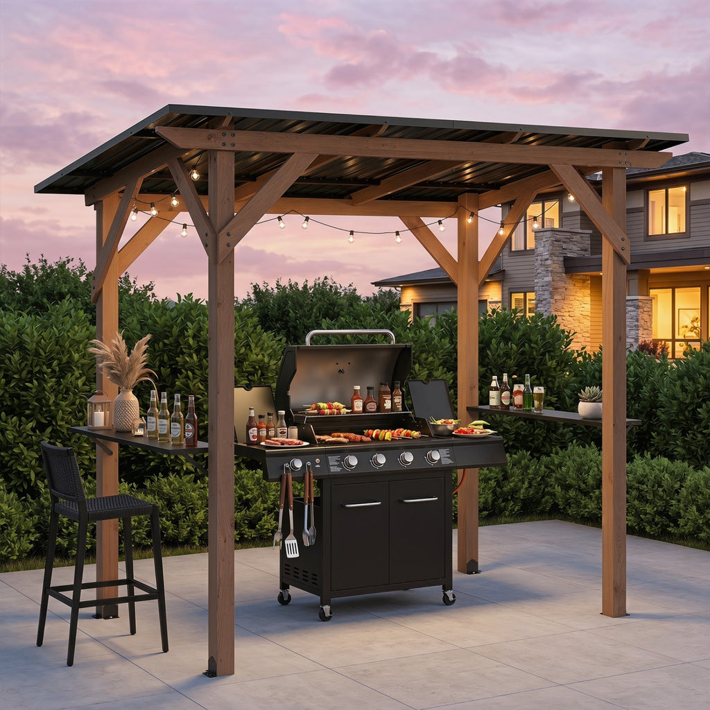 Cedar wood grill gazebo with metal roof, serving shelves, and gas grill in a backyard patio setting at sunset