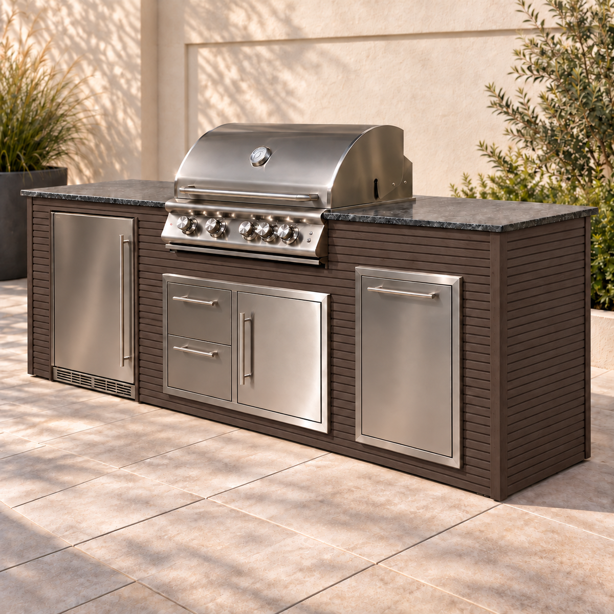 Firefly 8 ft outdoor kitchen island in Espresso 2+2 aluminum cladding, shown with a stainless steel grill, refrigerator, doors, drawers, and dark countertop on a patio.