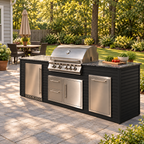 Firefly 8 ft outdoor kitchen island in Black 4+4 cladding, shown with a stainless steel grill and refrigerator on a patio in a wooded suburban backyard.