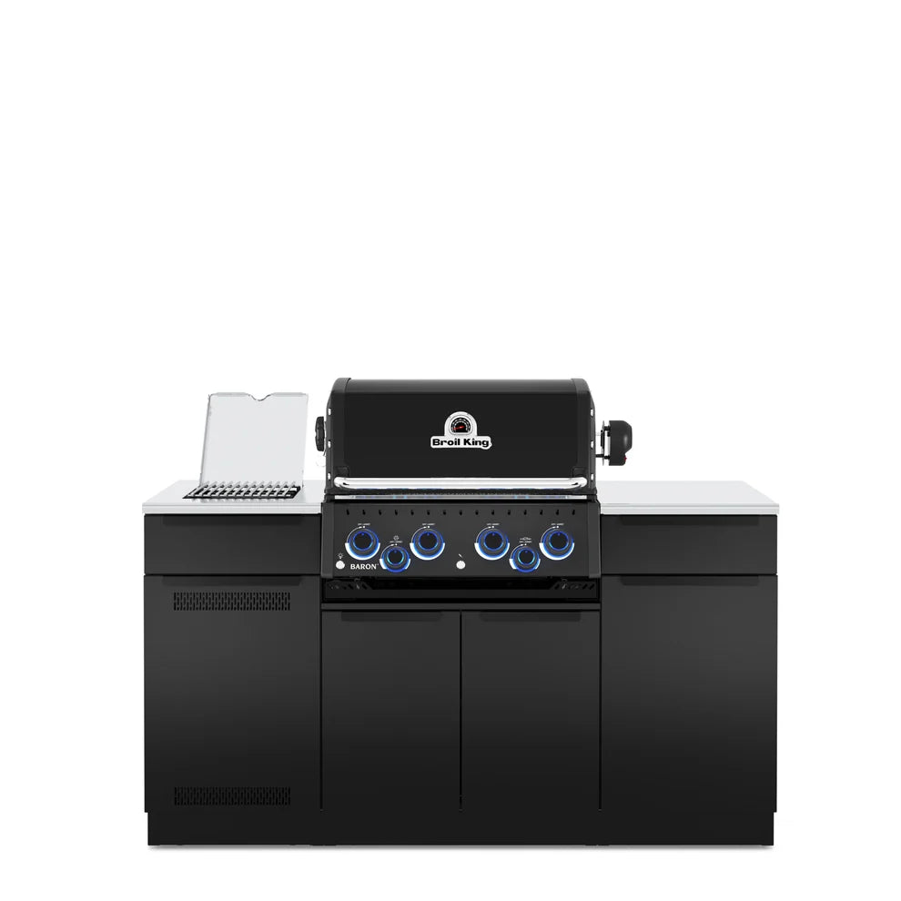 Front view of the Broil King Baron 490i Pro IR Shadow outdoor kitchen island featuring a four-burner gas grill, infrared side burner, stainless steel countertops, black cabinetry, and illuminated control knobs.