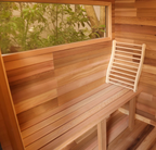 Red cedar bench and wooden backrest inside the ALEKO Bluet 6-person outdoor sauna.
