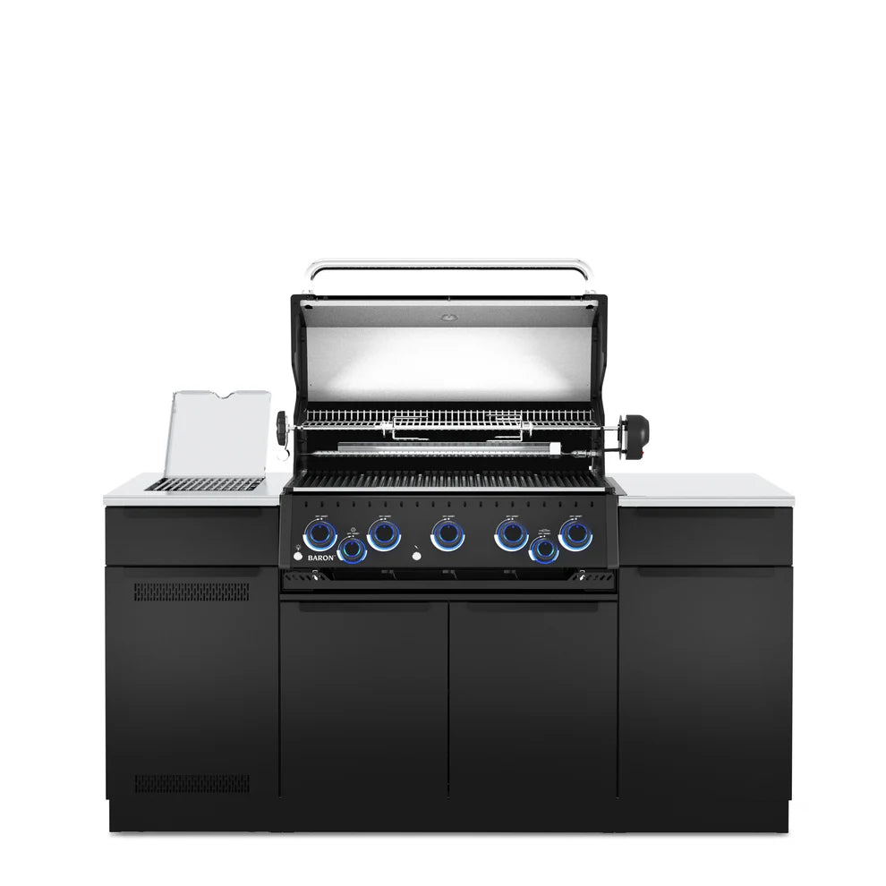 Front view of the Broil King Baron 590i Pro IR Shadow outdoor kitchen island with the grill hood open, showing stainless steel cooking grids, warming rack, infrared side burner, and black cabinetry.