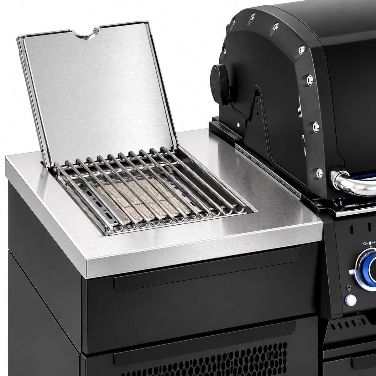 Close-up of the Broil King Baron 590i Pro IR Shadow outdoor kitchen's infrared side burner with open stainless steel lid, cooking grate, and surrounding countertop.