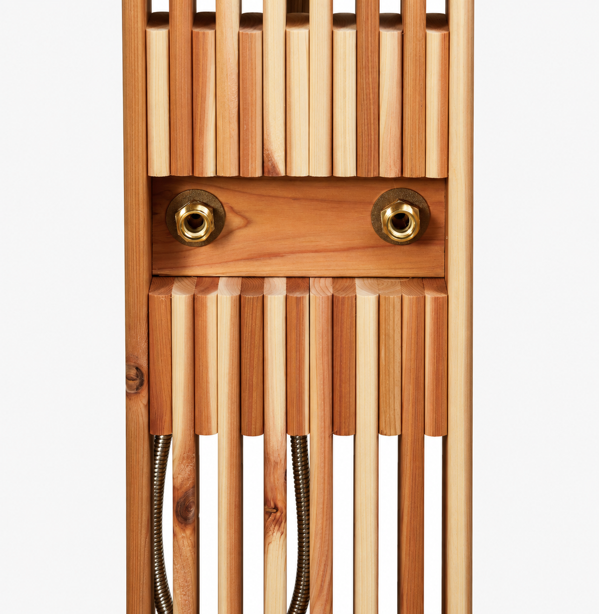 Close-up of cedar slatted outdoor shower panel with brass hot and cold water connection ports.