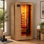 HeatWave Buena Vista 1–2 person hemlock infrared sauna with glass door and warm interior lighting in a home wellness space