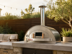 WPPO Karma 42-inch wood-fired pizza oven on an outdoor kitchen countertop with stainless steel chimney