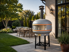 WPPO Lava 40-inch digital wood-fired pizza oven with convection fan in a modern backyard patio setting