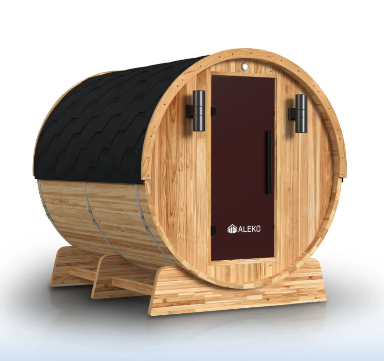 Aleko Liatris cedar barrel sauna with a black shingle roof, dark tinted door, and two exterior lights, shown from the front and side.