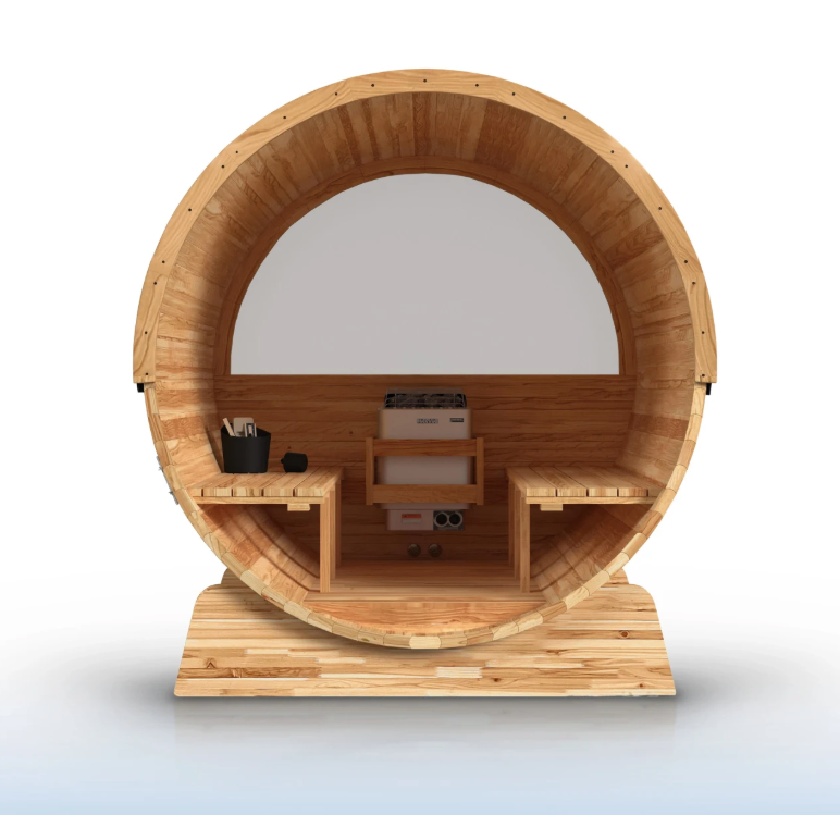 Aleko Liatris barrel sauna interior showing curved cedar walls, facing benches, a central heater, and a panoramic rear window.