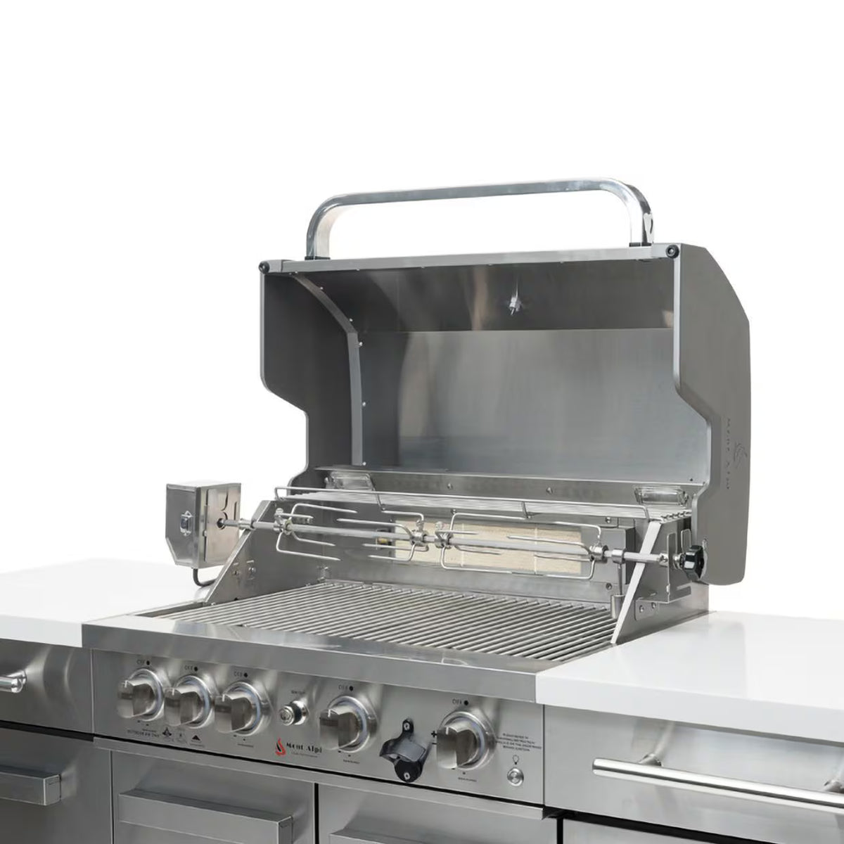 Mont Alpi 957 Compact stainless steel outdoor kitchen grill with open hood, installed rotisserie kit, stainless steel cooking grates, and white countertops
