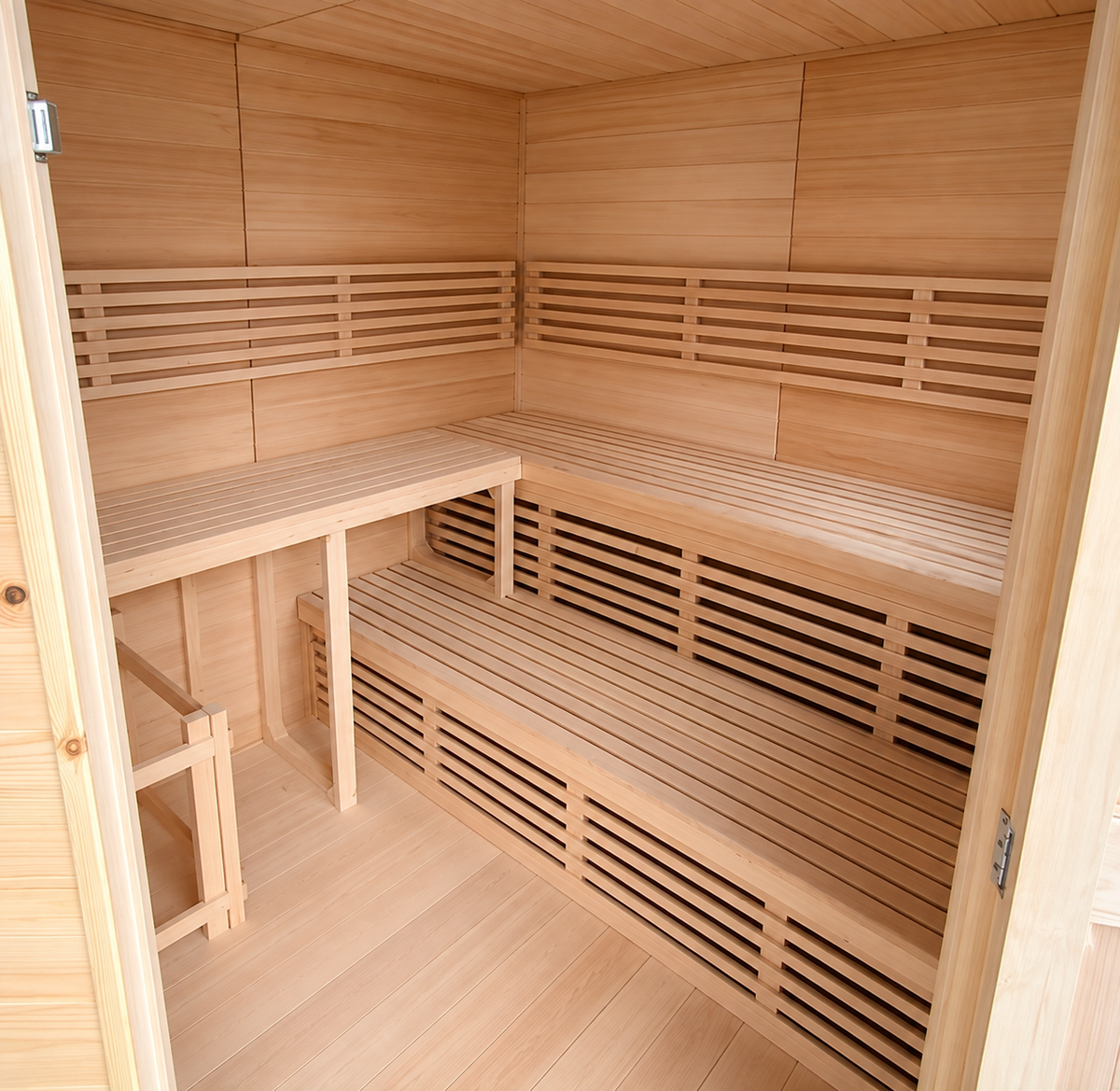 Interior view of the Thermowood sauna showing spacious tiered bench seating, natural wood construction, and an open multi-level layout.